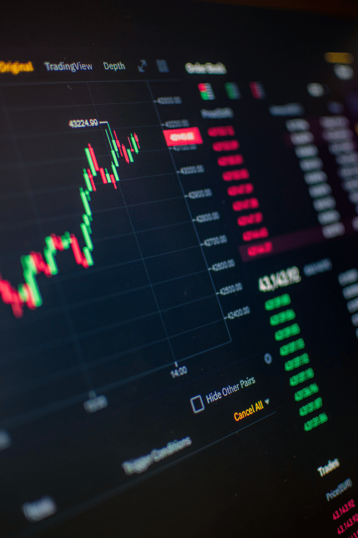 Close-up of a digital screen showing cryptocurrency market trading graph and data.